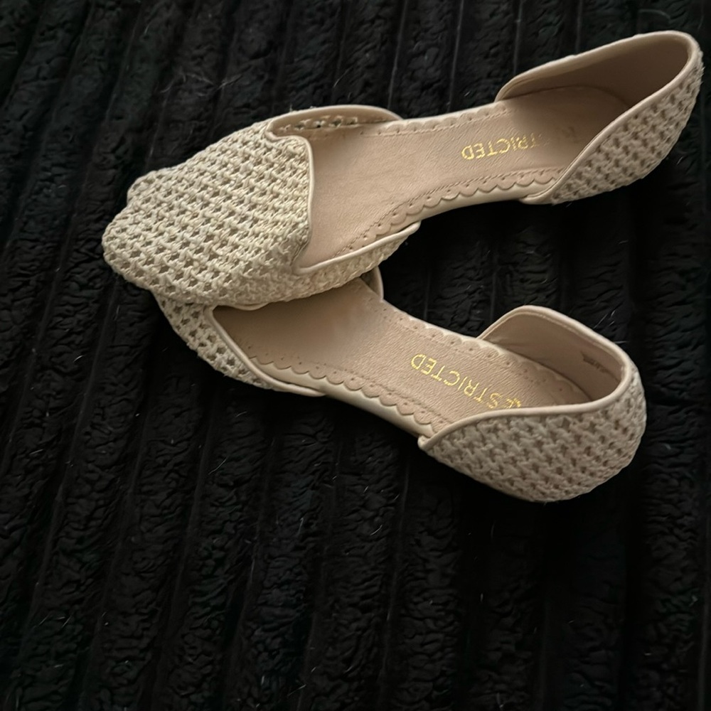 Restricted cream coloured flats